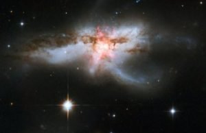 Black hole and stellar winds form giant butterfly, shut down star formation in galaxy Black hole and stellar winds form giant butterfly shut down star formation in galaxy