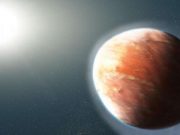 cropped Distant heavy metal gas planet is shaped like a football