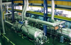 Alert system for failing nuclear plant pipes uses thin films and sound vibrations
