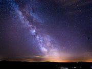 TESS dates an ancient collision with our galaxy