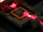 Control ions for quantum computing and sensing via on chip fiber optics