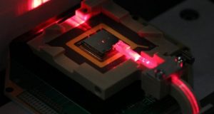 Control ions for quantum computing and sensing via on chip fiber optics