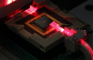 Control ions for quantum computing and sensing via on chip fiber optics