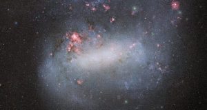 Dark energy camera snaps deepest photo yet of galactic siblings