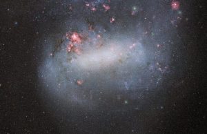 Dark energy camera snaps deepest photo yet of galactic siblings