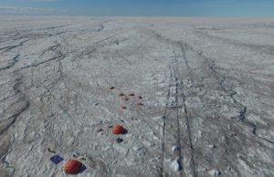 Microbes fuelled by wind blown mineral dust melt the Greenland ice sheet