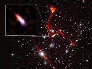 Cosmic lens reveals faint radio galaxy