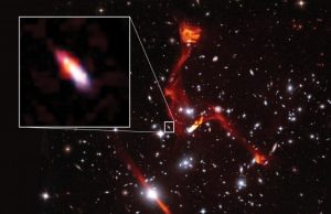 Cosmic lens reveals faint radio galaxy