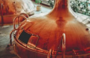 Separating beer waste into proteins for foods and fiber for biofuels